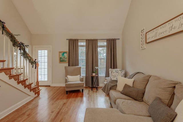 425 Wildewood Trl, Chickamauga, GA 30707 - living room with stairway, light wood-type flooring, and vaulted ceiling