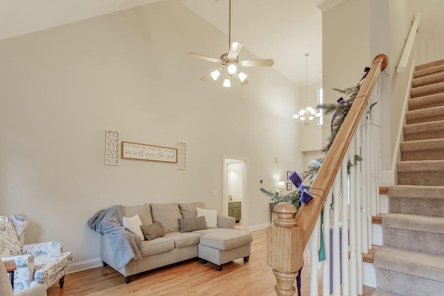 425 Wildewood Trl, Chickamauga, GA 30707 - living area with light wood-style floors, high vaulted ceiling, ceiling fan, and stairs