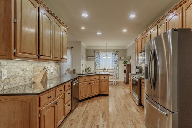 425 Wildewood Trl, Chickamauga, GA 30707 - kitchen featuring a peninsula, crown molding, decorative backsplash, stainless steel appliances, and a sink