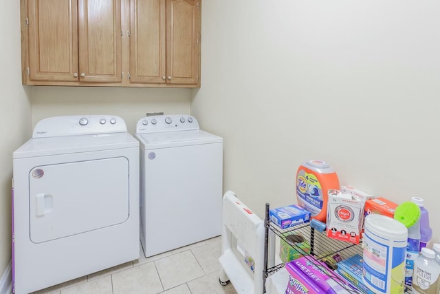 425 Wildewood Trl, Chickamauga, GA 30707 - clothes washing area with light tile patterned flooring, washing machine and clothes dryer, and cabinet space
