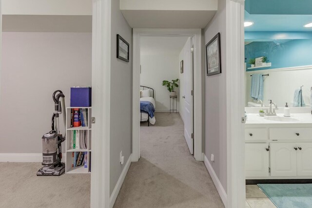 425 Wildewood Trl, Chickamauga, GA 30707 - hall featuring a sink, baseboards, and light carpet