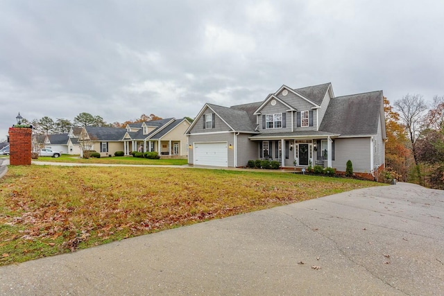 425 Wildewood Trl, Chickamauga, GA 30707 - view of front of house featuring a garage, a front yard, concrete driveway, and covered porch