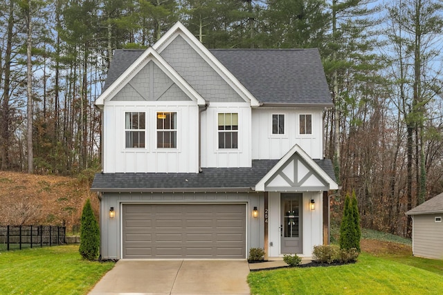 view of front of property with a garage and a front yard