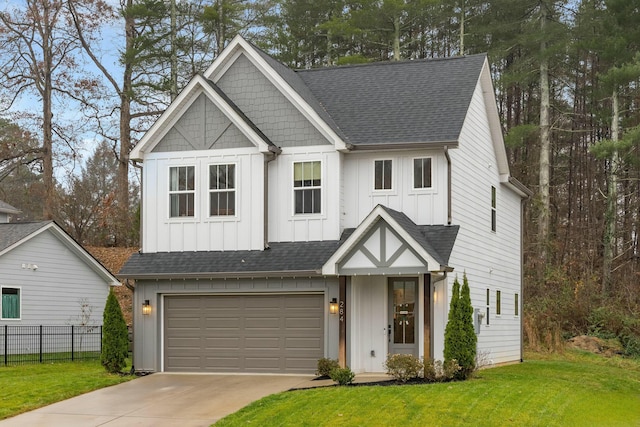 view of front of home featuring a garage and a front lawn