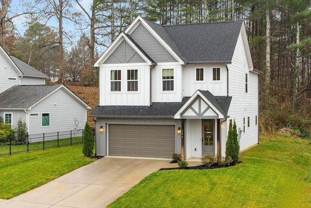 view of front of home featuring a front yard and a garage