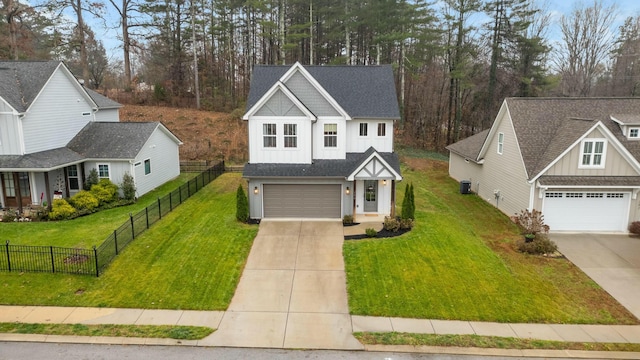 view of front facade with a front yard and a garage