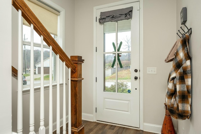 doorway to outside with dark wood-type flooring