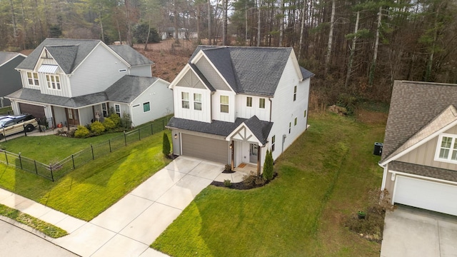 view of front facade with a front lawn and a garage