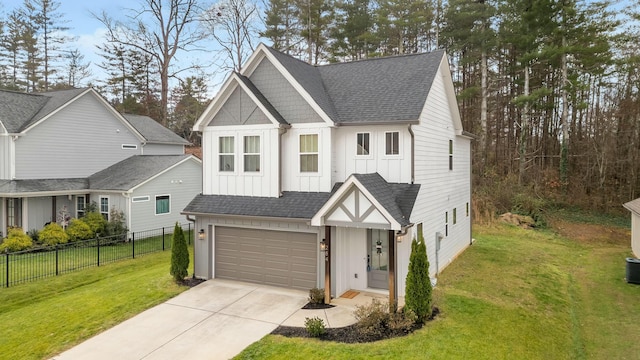 view of front of house with a garage and a front yard