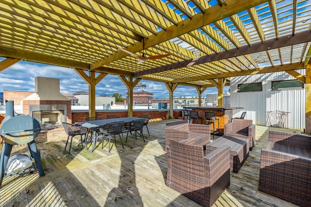 wooden deck featuring an outdoor living space with a fireplace and outdoor dining area