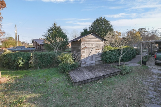 view of outdoor structure featuring a lawn