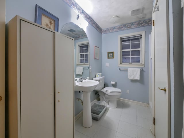 bathroom with tile patterned floors and toilet