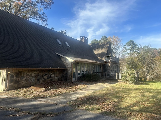 view of property exterior featuring a yard