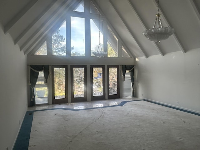 interior space featuring beamed ceiling and high vaulted ceiling