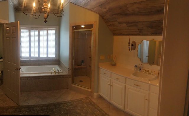 bathroom featuring tile patterned floors, vanity, a notable chandelier, shower with separate bathtub, and lofted ceiling