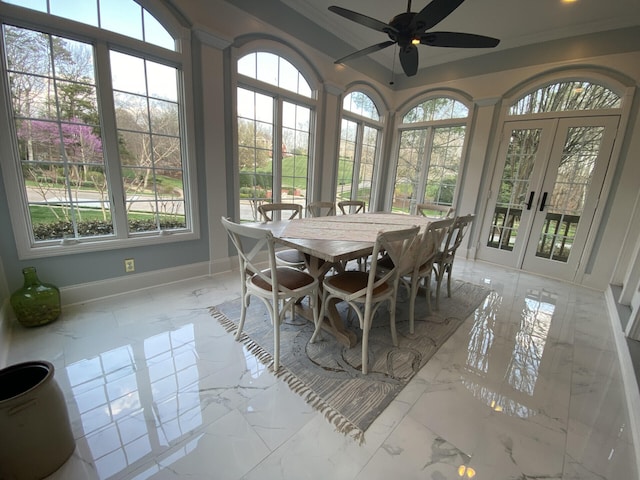 sunroom featuring ceiling fan, plenty of natural light, and french doors