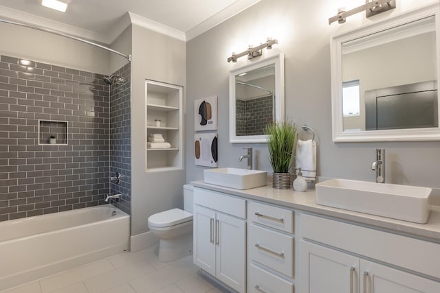 full bathroom featuring tile patterned flooring, built in shelves, tiled shower / bath combo, ornamental molding, and vanity