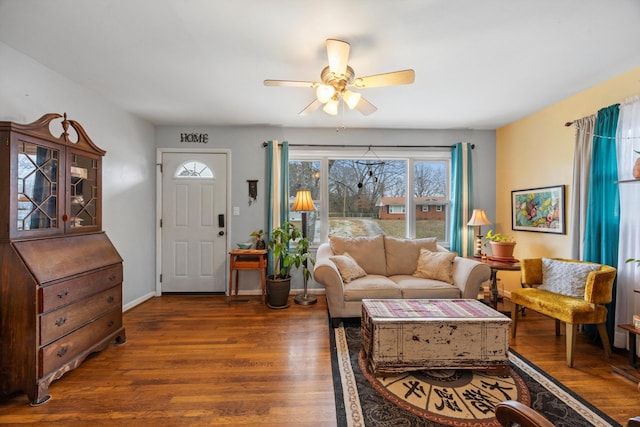 living room featuring ceiling fan and dark hardwood / wood-style floors