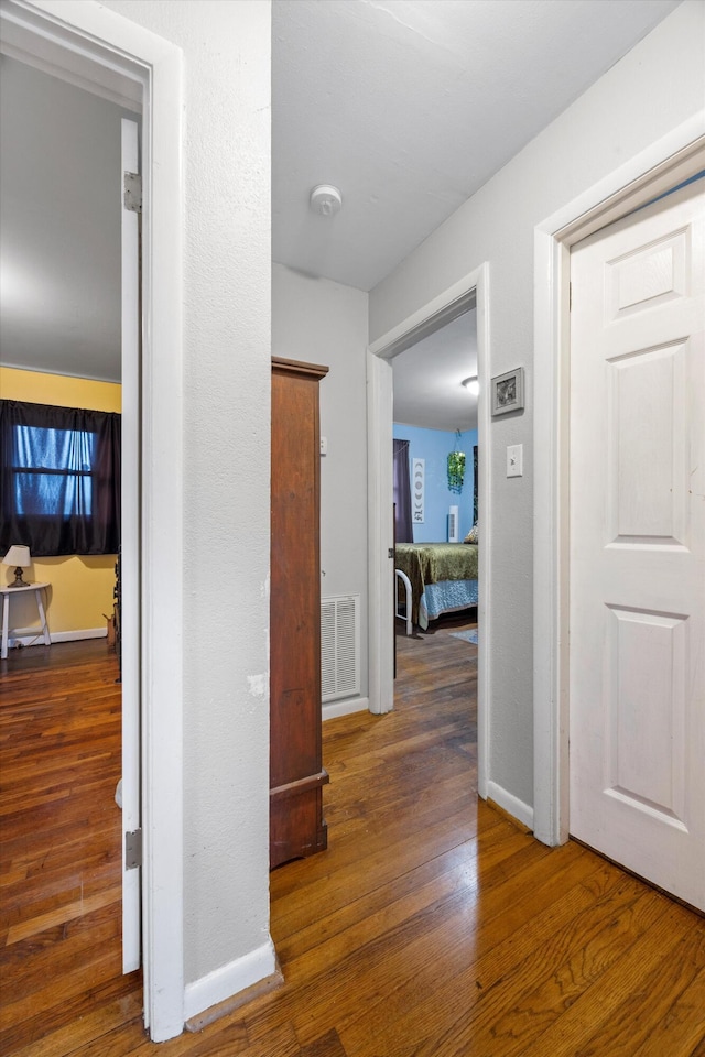 hall featuring dark wood-type flooring