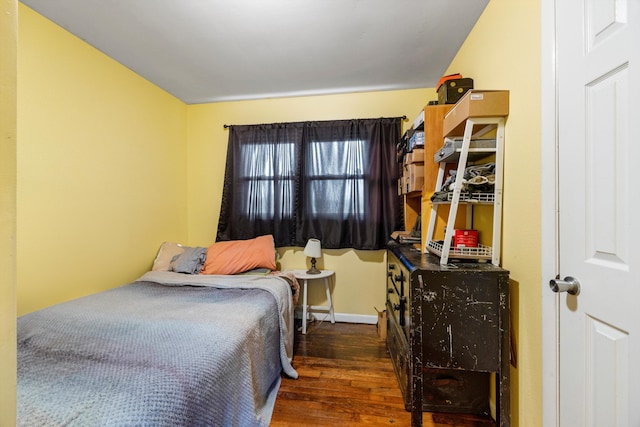 bedroom featuring dark hardwood / wood-style flooring