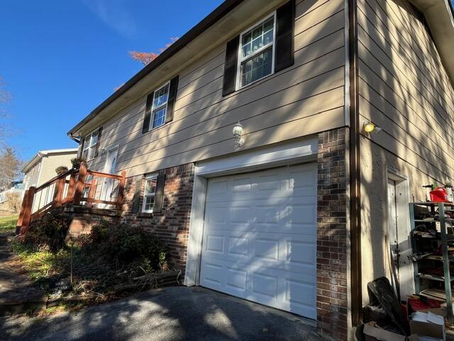 view of side of property featuring a garage