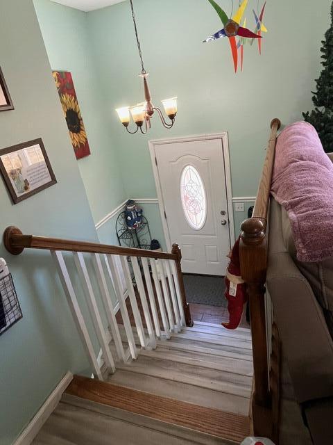 foyer featuring a notable chandelier and hardwood / wood-style flooring