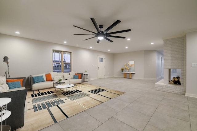 living room featuring ceiling fan, light tile patterned floors, and a fireplace