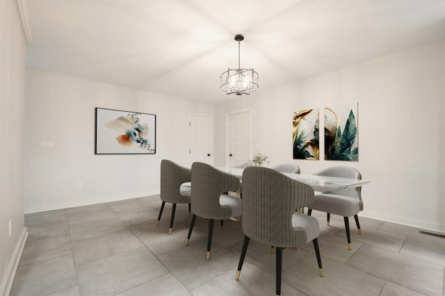 dining space featuring a notable chandelier