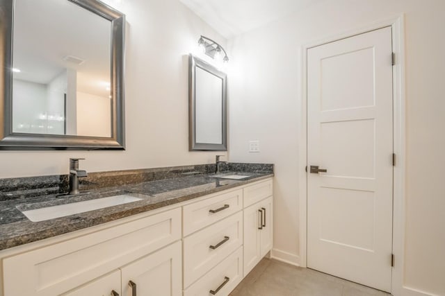 bathroom featuring vanity and tile patterned floors