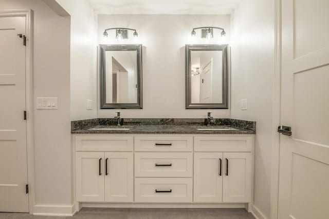 bathroom featuring tile patterned flooring and vanity