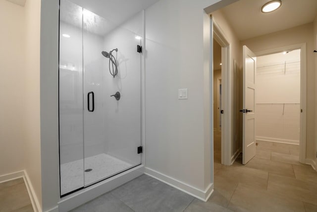 bathroom with tile patterned flooring and an enclosed shower