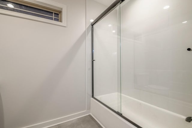 bathroom with tile patterned floors and enclosed tub / shower combo