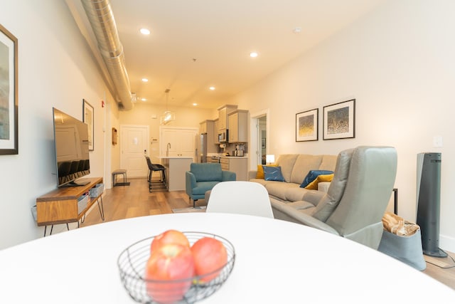 dining space featuring light wood-type flooring