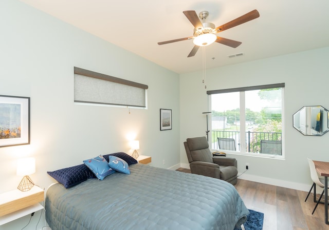 bedroom featuring light wood-type flooring and ceiling fan