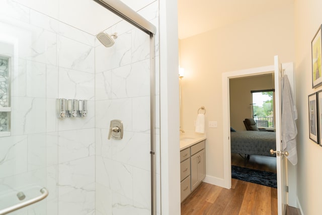 bathroom with vanity, hardwood / wood-style flooring, and an enclosed shower