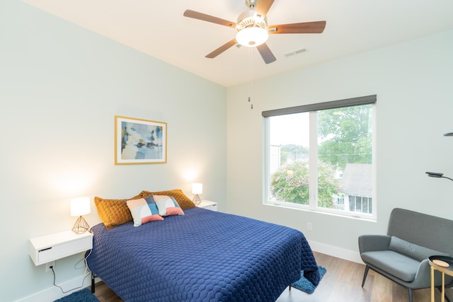 bedroom featuring hardwood / wood-style floors and ceiling fan