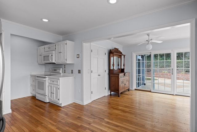 kitchen featuring ornamental molding, white appliances, ceiling fan, white cabinets, and light hardwood / wood-style floors