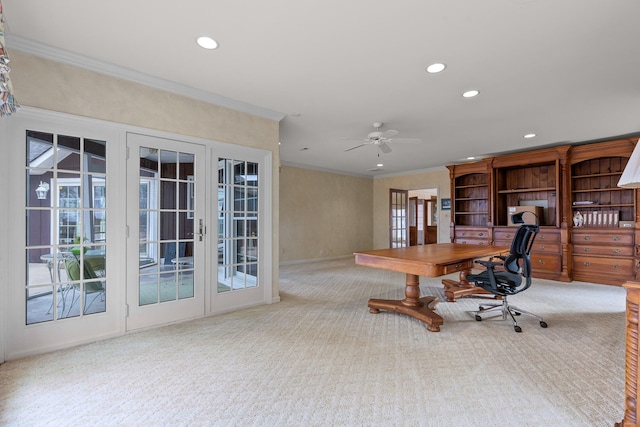 home office featuring light carpet, french doors, ceiling fan, and ornamental molding