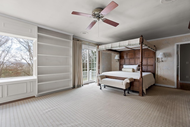 bedroom featuring carpet flooring, ceiling fan, and ornamental molding