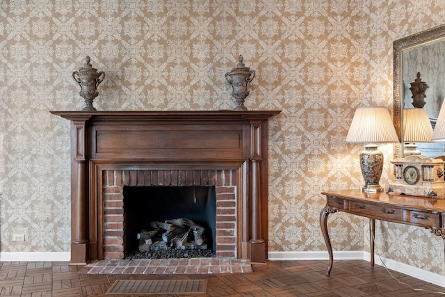 room details featuring parquet flooring and a brick fireplace