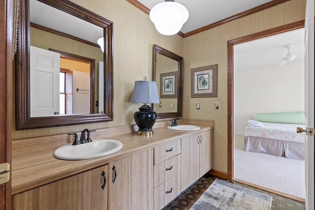 bathroom with vanity, ceiling fan, and crown molding