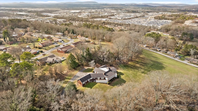 birds eye view of property with a mountain view