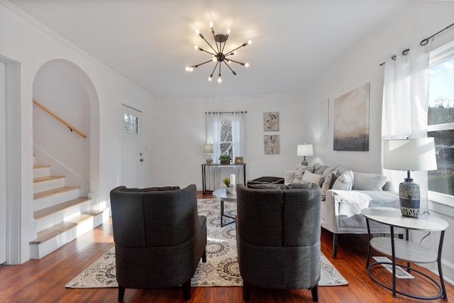 living room with a chandelier and hardwood / wood-style flooring