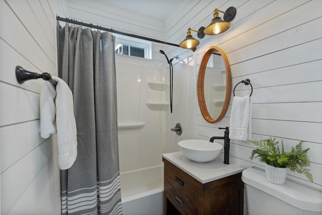 full bathroom featuring shower / bath combo with shower curtain, toilet, vanity, and wood walls