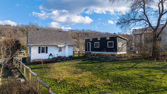 back of property featuring a yard