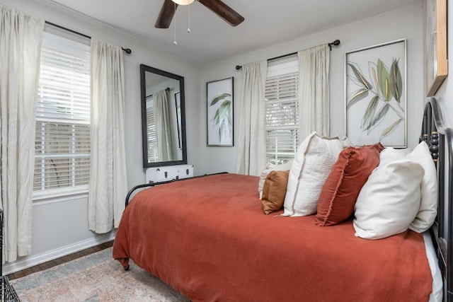 bedroom with hardwood / wood-style floors and ceiling fan