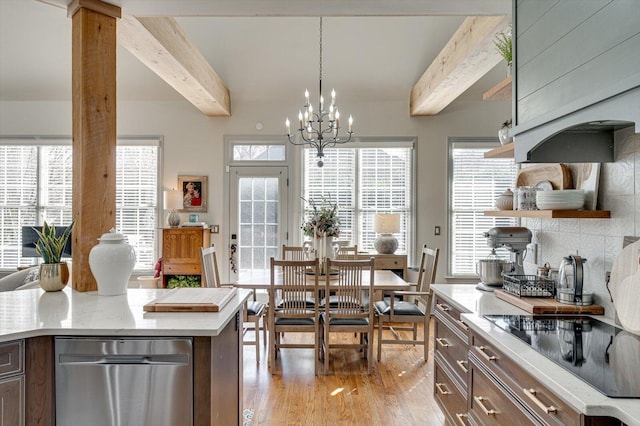 kitchen featuring light hardwood / wood-style flooring, black electric cooktop, beamed ceiling, decorative light fixtures, and dark brown cabinetry