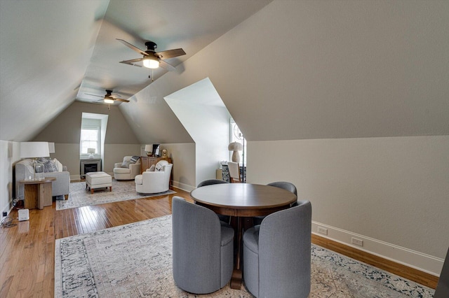 interior space with light hardwood / wood-style floors, vaulted ceiling, and ceiling fan