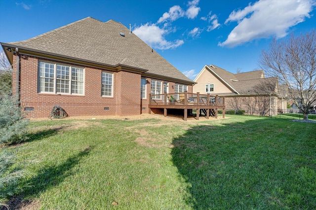 back of house featuring a yard and a wooden deck