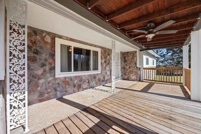 deck featuring covered porch and ceiling fan